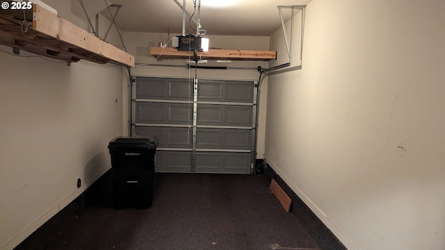 garage featuring baseboards and a garage door opener