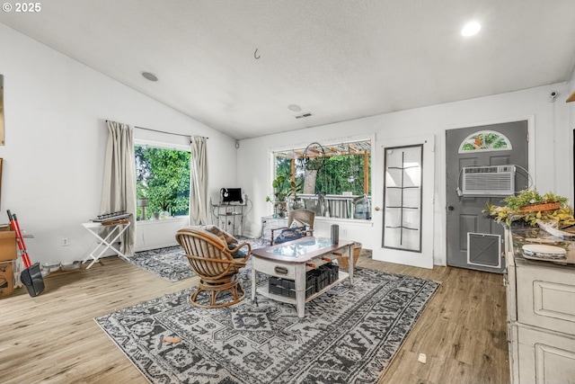 731 SE Forest Glen Rd, Estacada, OR 97023 - dining room featuring lofted ceiling, light wood-type flooring, recessed lighting, and a wall unit AC
