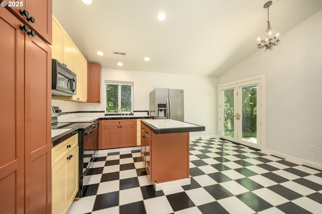 865 SE Roberts Ct, Mcminnville, OR 97128 - kitchen featuring a kitchen island, tile countertops, visible vents, black appliances, and light floors