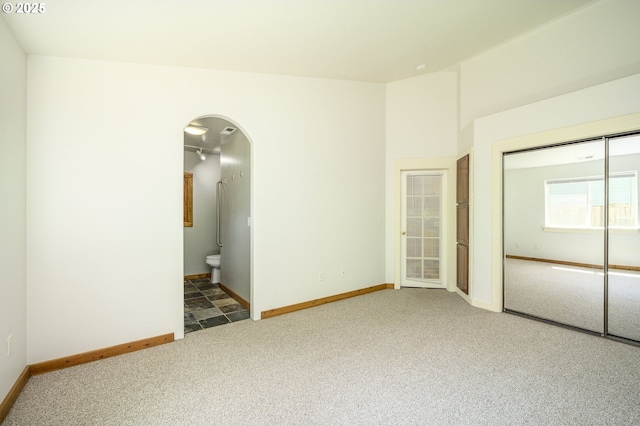 865 SE Roberts Ct, Mcminnville, OR 97128 - carpeted empty room featuring arched walkways and baseboards