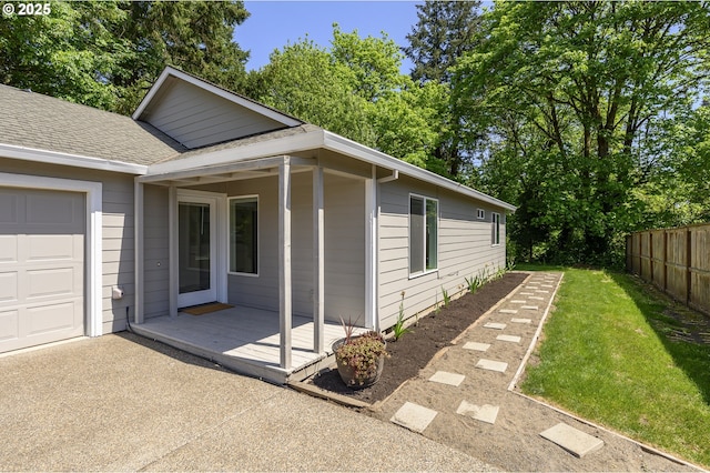 865 SE Roberts Ct, Mcminnville, OR 97128 - view of home's exterior featuring fence, a shingled roof, and a yard
