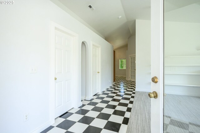865 SE Roberts Ct, Mcminnville, OR 97128 - hallway featuring dark floors, vaulted ceiling, baseboards, and visible vents