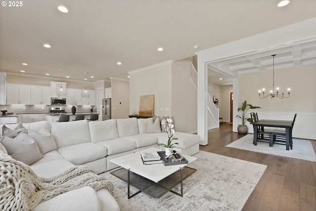 16943 SW Snowdale St, Beaverton, OR 97007 - living area featuring a chandelier, recessed lighting, stairway, coffered ceiling, and ornamental molding