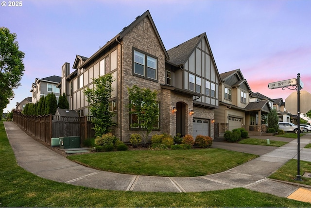 16943 SW Snowdale St, Beaverton, OR 97007 - view of front facade with a garage, brick siding, central AC unit, and driveway