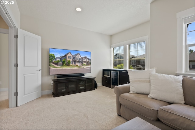 16943 SW Snowdale St, Beaverton, OR 97007 - living room with carpet flooring, plenty of natural light, baseboards, and recessed lighting