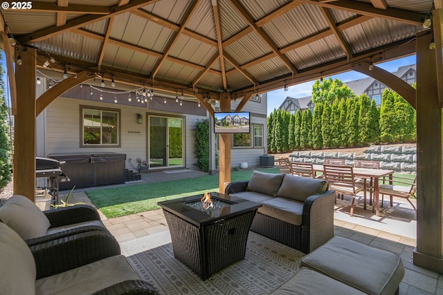 16943 SW Snowdale St, Beaverton, OR 97007 - view of patio with a hot tub, a gazebo, and an outdoor living space with a fire pit