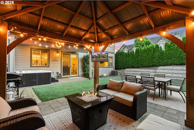 16943 SW Snowdale St, Beaverton, OR 97007 - view of patio featuring a gazebo, an outdoor living space with a fire pit, outdoor dining area, and a hot tub