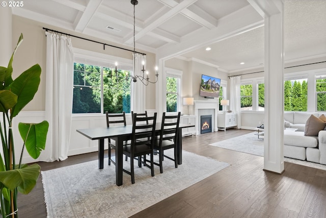 16943 SW Snowdale St, Beaverton, OR 97007 - dining area featuring healthy amount of natural light, beamed ceiling, wainscoting, dark wood finished floors, and a decorative wall