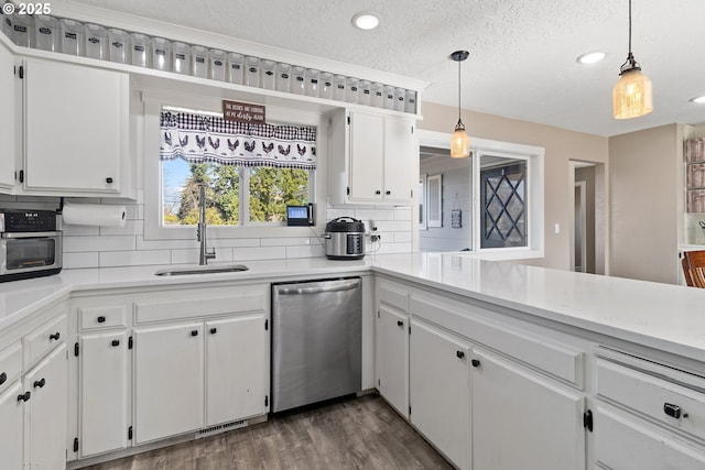 kitchen with dark wood-style floors, backsplash, dishwasher, and a sink