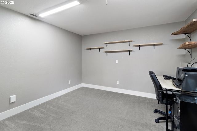 office space featuring baseboards, visible vents, and carpet floors