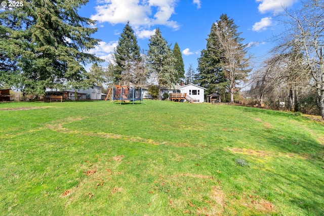 view of yard featuring a trampoline