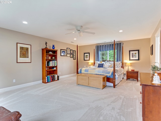 bedroom with ceiling fan and light carpet