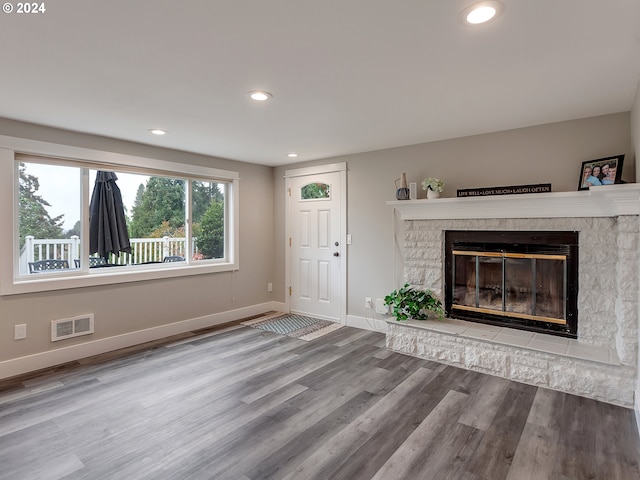 unfurnished living room with wood-type flooring