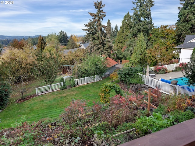 view of yard featuring a covered pool