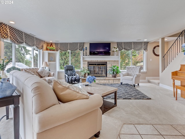 living room with carpet, a fireplace, and a textured ceiling