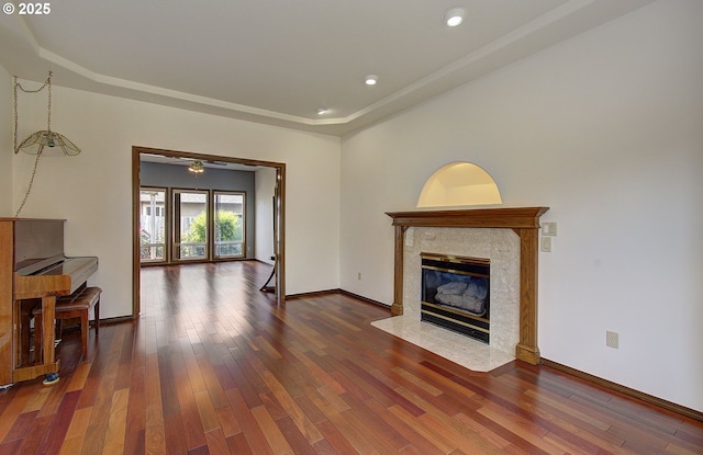 13107 SE 26th St, Vancouver, WA 98683 - living area featuring a tray ceiling, wood-type flooring, a high end fireplace, baseboards, and recessed lighting