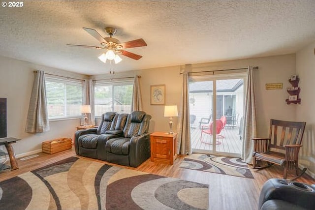 2919 SE 3rd Ave, Camas, WA 98607 - living area featuring light wood-type flooring, a textured ceiling, and ceiling fan
