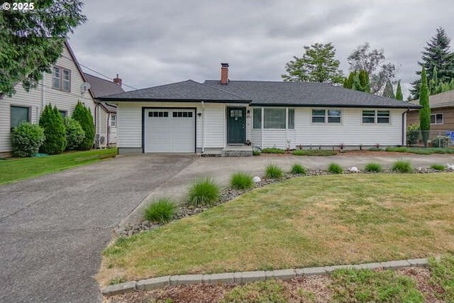 2919 SE 3rd Ave, Camas, WA 98607 - ranch-style house with an attached garage, asphalt driveway, a front yard, and a chimney