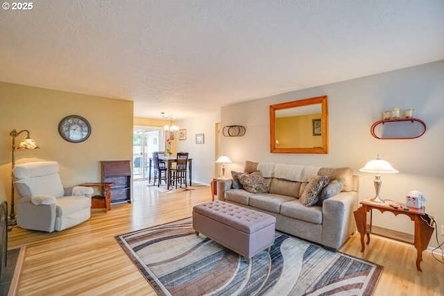 2919 SE 3rd Ave, Camas, WA 98607 - living area with wood finished floors and a chandelier