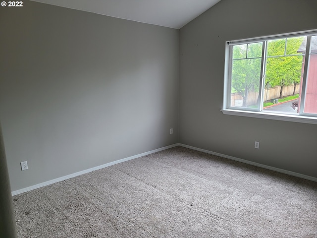 667 SE 5th Ave, Hillsboro, OR 97123 - spare room with vaulted ceiling and carpet