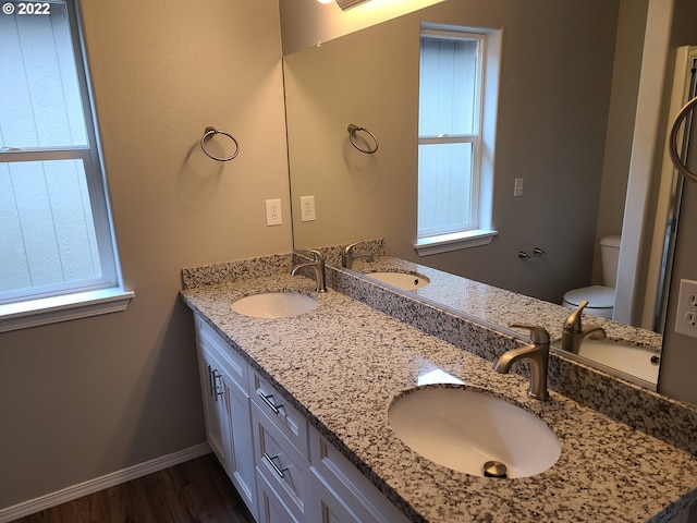 667 SE 5th Ave, Hillsboro, OR 97123 - full bath featuring healthy amount of natural light, wood finished floors, and double vanity
