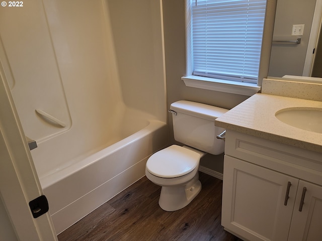 667 SE 5th Ave, Hillsboro, OR 97123 - bathroom featuring wood finished floors, vanity, and bathing tub / shower combination