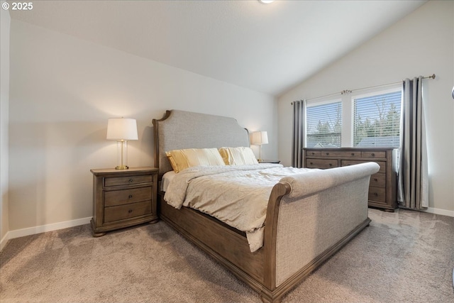 bedroom with light carpet, baseboards, and vaulted ceiling