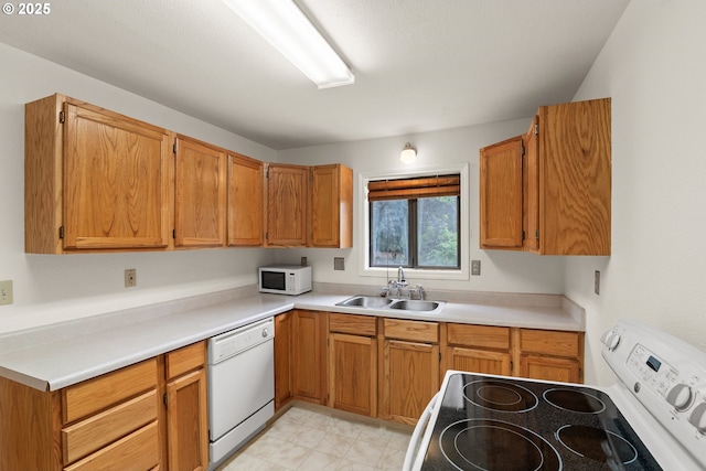 7940 SE 75th Pl, Portland, OR 97206 - kitchen featuring white appliances, a sink, and light countertops