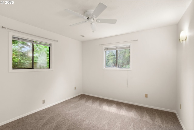 7940 SE 75th Pl, Portland, OR 97206 - carpeted empty room featuring healthy amount of natural light, baseboards, and a ceiling fan