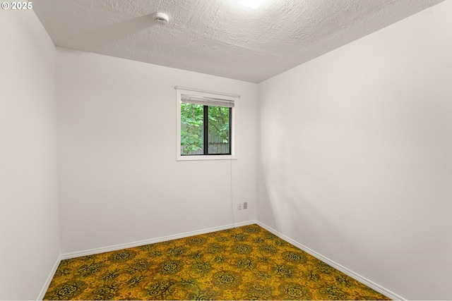 7940 SE 75th Pl, Portland, OR 97206 - empty room with a smoke detector, baseboards, and a textured ceiling