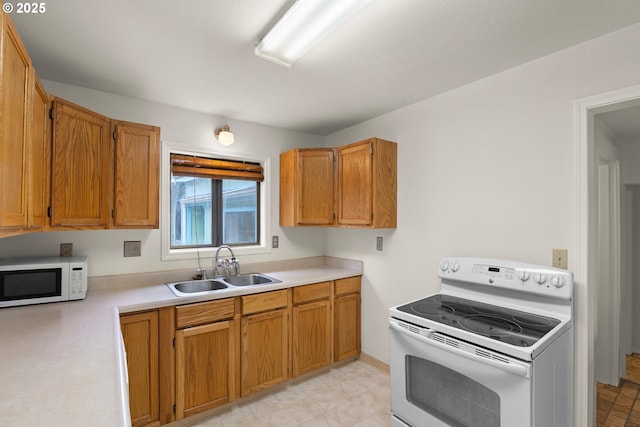 7940 SE 75th Pl, Portland, OR 97206 - kitchen with white appliances, a sink, light countertops, and brown cabinets
