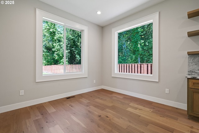 16010 NE 152nd Ave, Brush Prairie, WA 98606 - unfurnished dining area featuring baseboards, light wood-style flooring, and recessed lighting