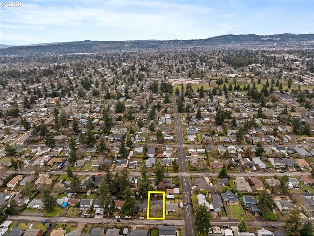 birds eye view of property with a mountain view