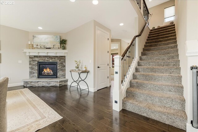 2025 De Vries Way W, Linn, OR 97068 - staircase with wood finished floors, baseboards, a fireplace, and recessed lighting