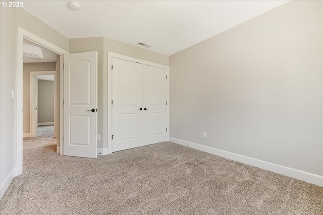 2025 De Vries Way W, Linn, OR 97068 - unfurnished bedroom with carpet flooring, baseboards, and a closet