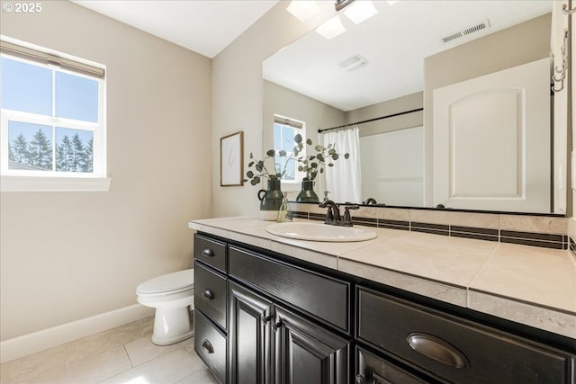 2025 De Vries Way W, Linn, OR 97068 - full bathroom featuring baseboards, toilet, vanity, tile patterned flooring, and curtained shower