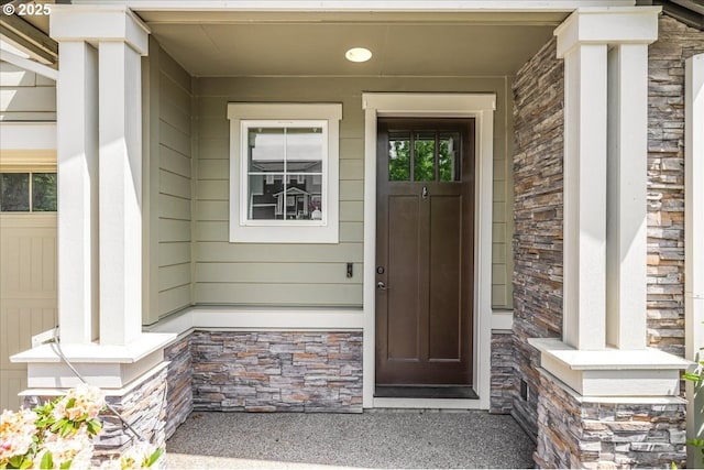 2025 De Vries Way W, Linn, OR 97068 - doorway to property featuring stone siding and a porch