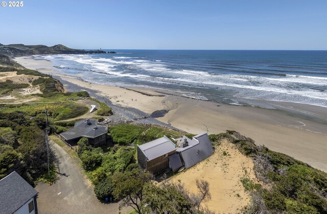 aerial view of property's location featuring expansive beach
