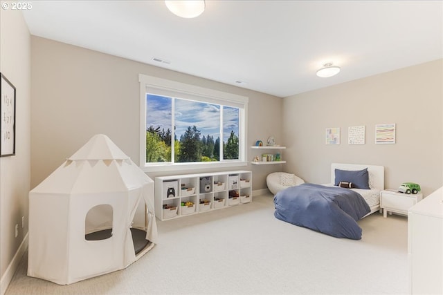 bedroom featuring carpet flooring and visible vents