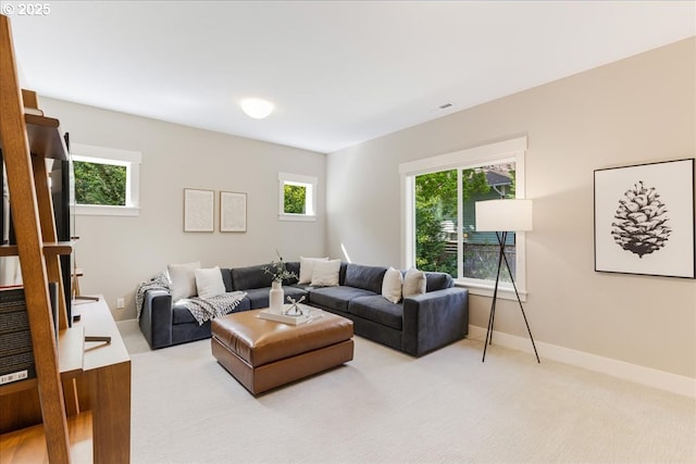 4726 SW 60th Pl, Portland, OR 97221 - living room with healthy amount of natural light, light carpet, and baseboards