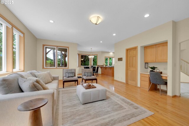 2038 Morning View Dr, Eugene, OR 97405 - living area featuring built in study area, light wood-type flooring, healthy amount of natural light, and recessed lighting