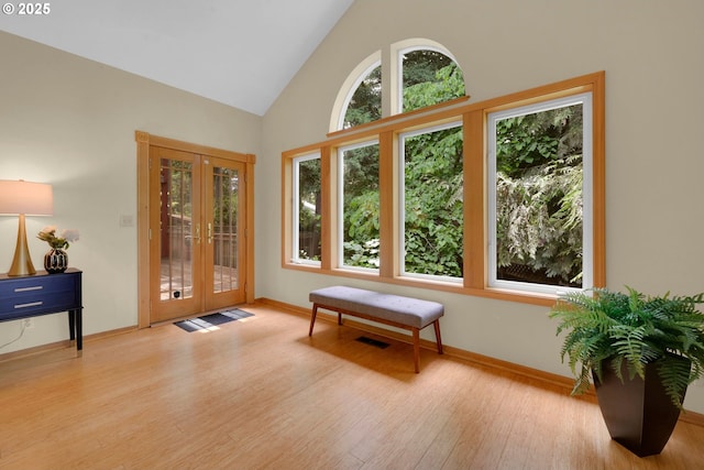 2038 Morning View Dr, Eugene, OR 97405 - entryway featuring french doors, plenty of natural light, wood finished floors, and high vaulted ceiling