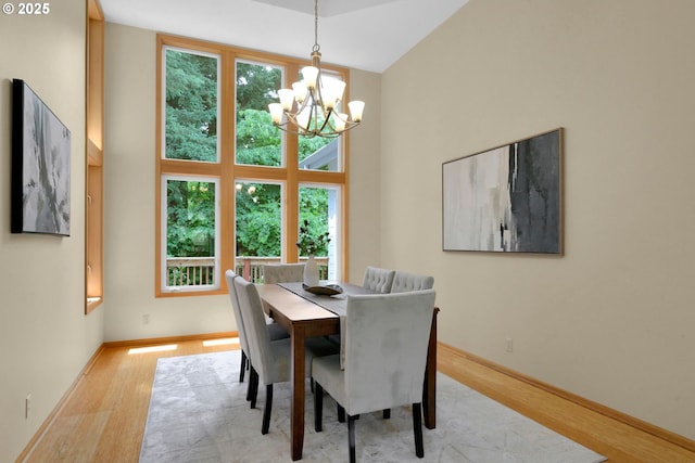 2038 Morning View Dr, Eugene, OR 97405 - dining area with a chandelier, healthy amount of natural light, wood finished floors, and high vaulted ceiling