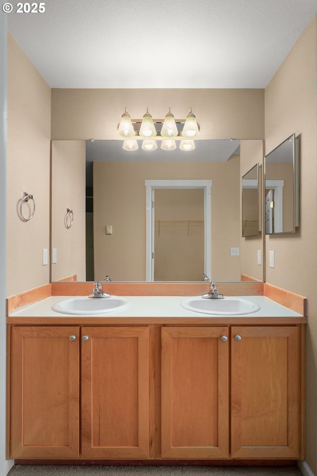 bathroom featuring vanity and a textured ceiling