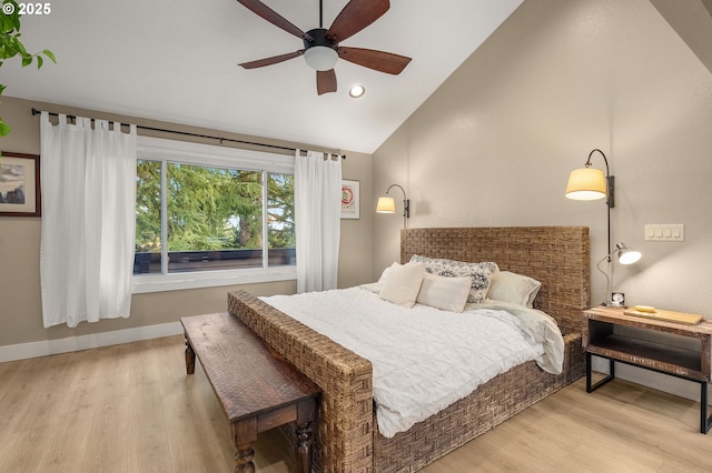 bedroom with vaulted ceiling, recessed lighting, wood finished floors, and baseboards