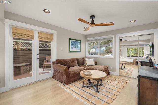 living room with recessed lighting, baseboards, ceiling fan, and light wood finished floors