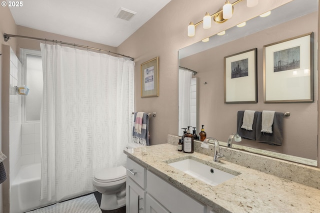 bathroom featuring toilet, vanity, visible vents, and shower / tub combo with curtain