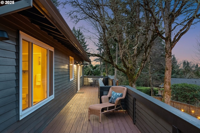 wooden deck featuring a water view