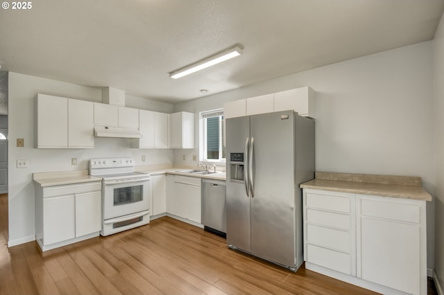 13712 NE 91st St, Vancouver, WA 98682 - kitchen featuring stainless steel appliances, under cabinet range hood, wood finished floors, and white cabinets