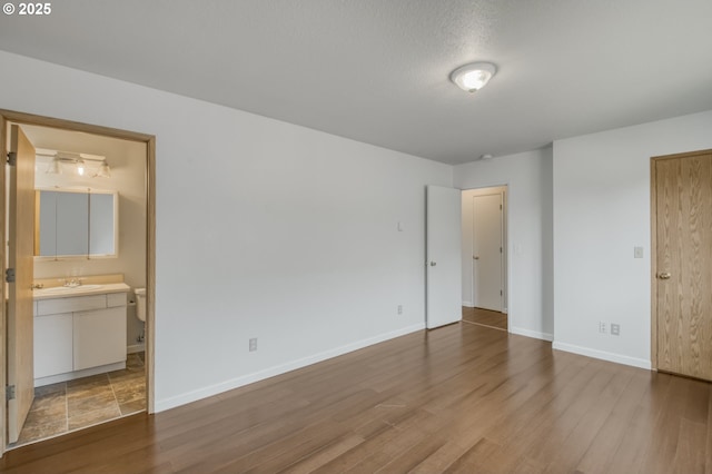 13712 NE 91st St, Vancouver, WA 98682 - unfurnished bedroom featuring wood finished floors and connected bathroom